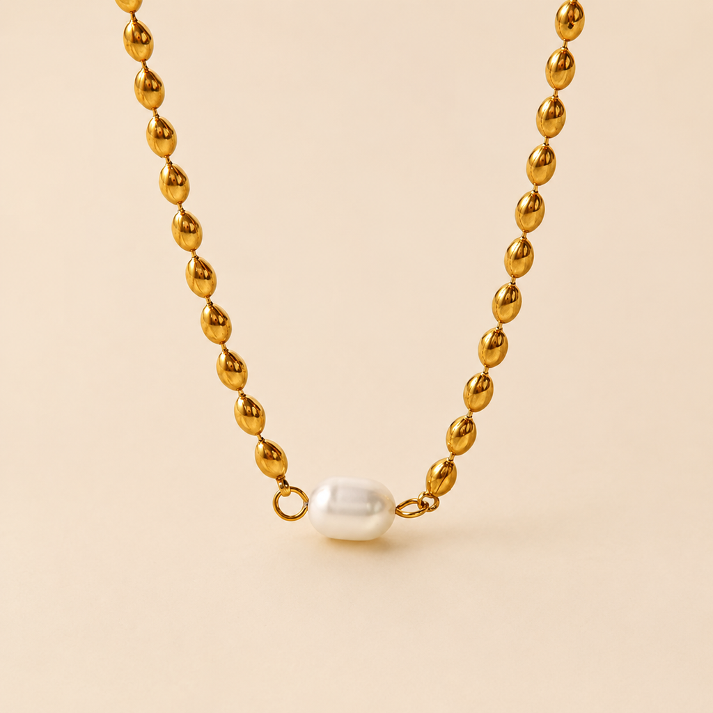 Collar dentado bañado en oro con perla