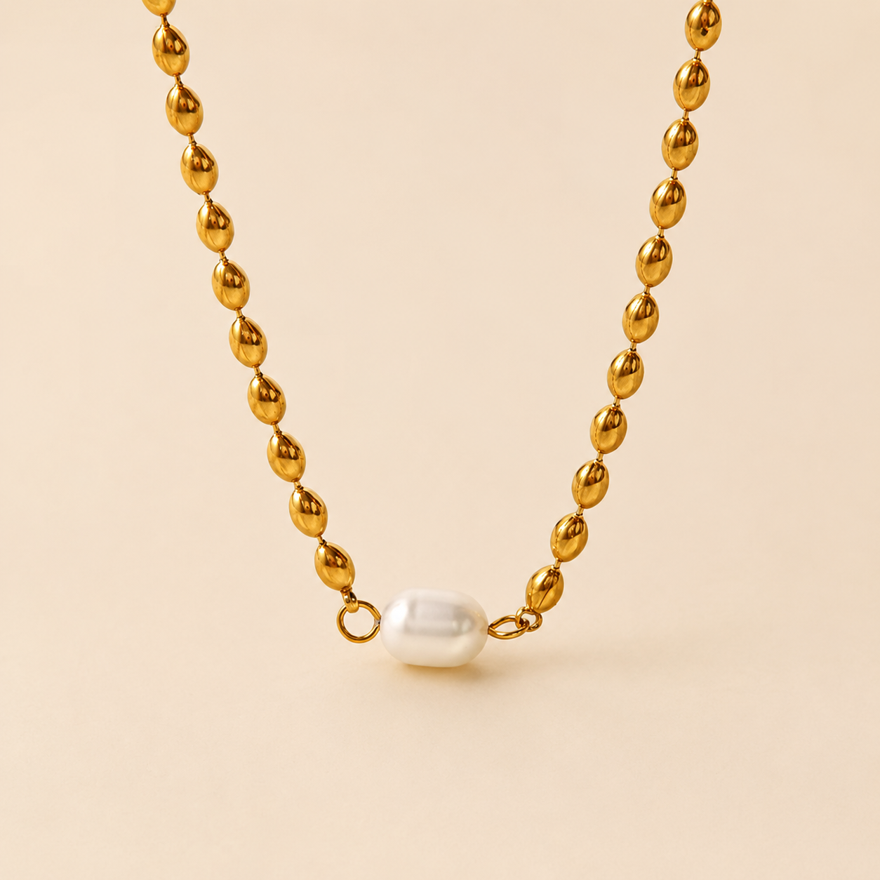 Collar dentado bañado en oro con perla