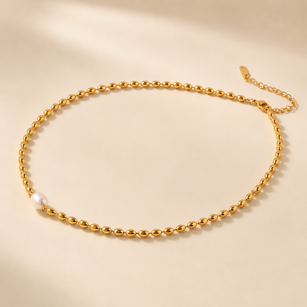 Collar dentado bañado en oro con perla