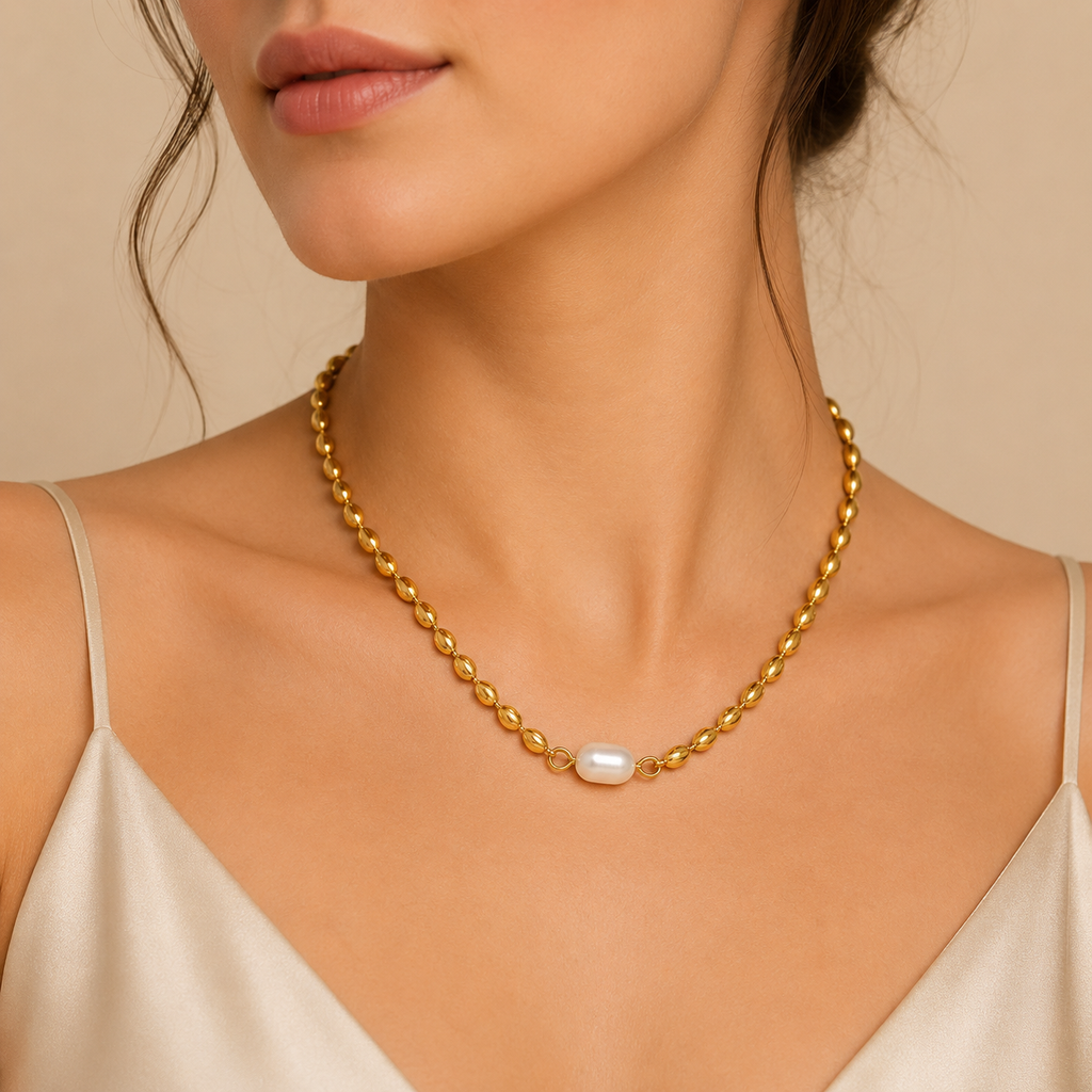 Collar dentado bañado en oro con perla