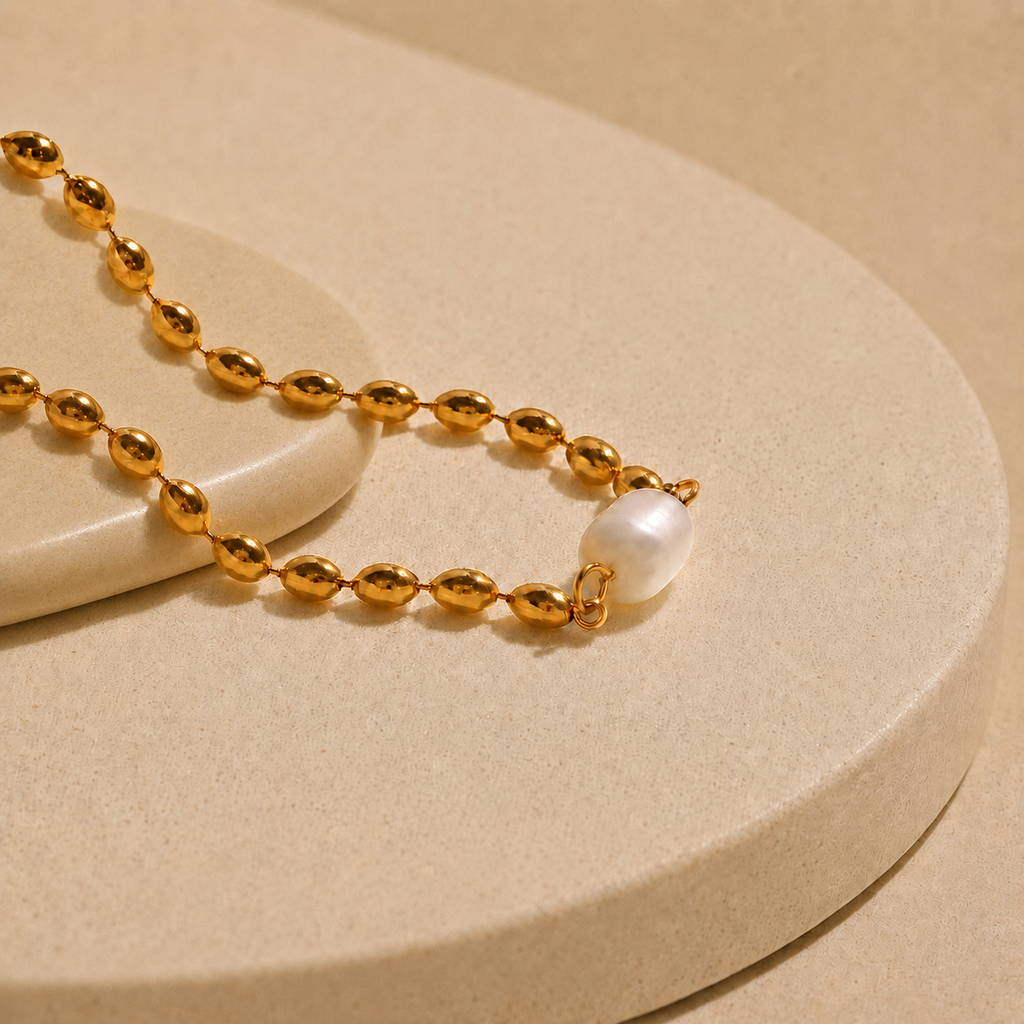 Collar dentado bañado en oro con perla